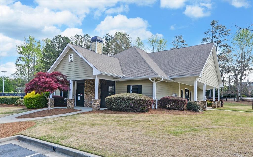 4286 Cami Way Northeast Buford, GA 30519 - Photo 36 of 39 a front view of a house with garden