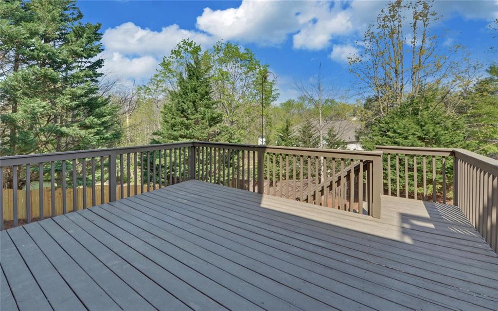 4286 Cami Way Northeast Buford, GA 30519 - Photo 37 of 39 a balcony with wooden floor and fence