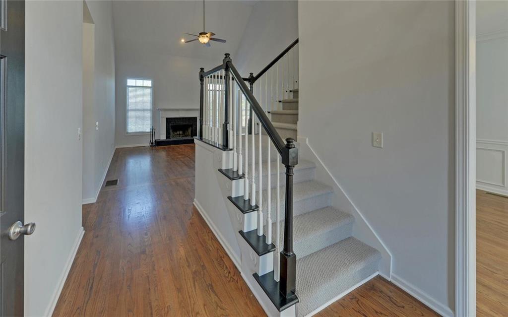 4286 Cami Way Northeast Buford, GA 30519 - Photo 4 of 39 a view of entryway and hall with wooden floor