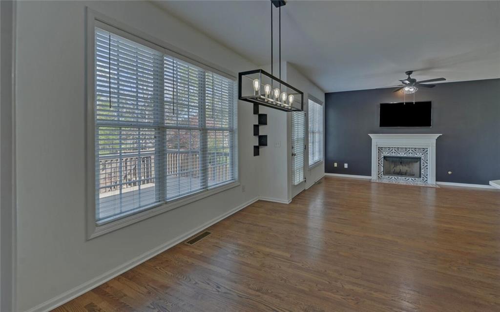 4286 Cami Way Northeast Buford, GA 30519 - Photo 8 of 39 a view of an empty room with a kitchen and a window