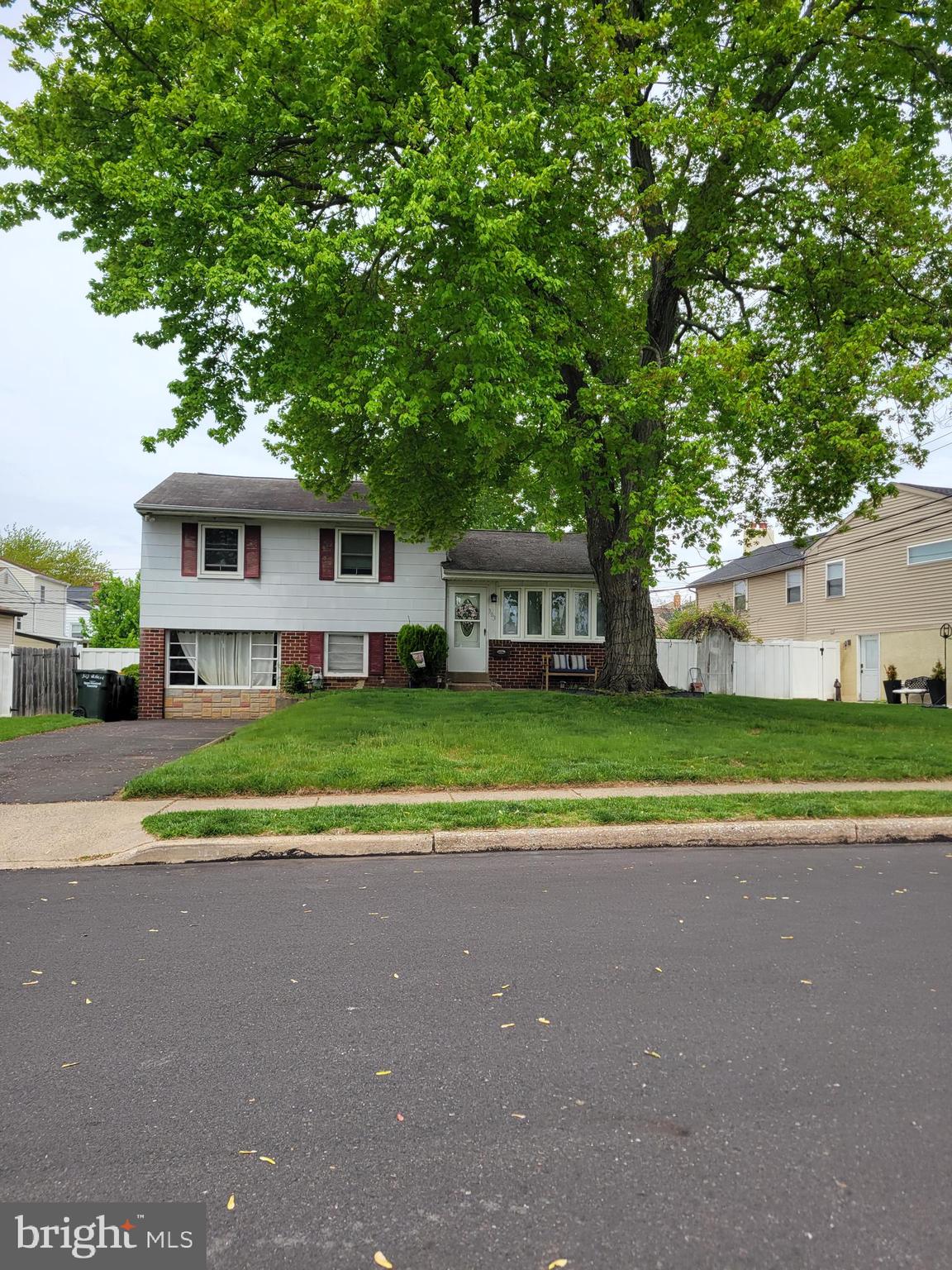 303 Willard Road Hatboro, PA 19040 - Photo 3 of 5 a view of a house with a big yard and large trees