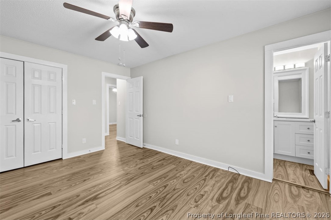 3305 Hunting Bay Drive Spring Lake, NC 28390 - Photo 17 of 27 a view of an empty room with wooden floor
