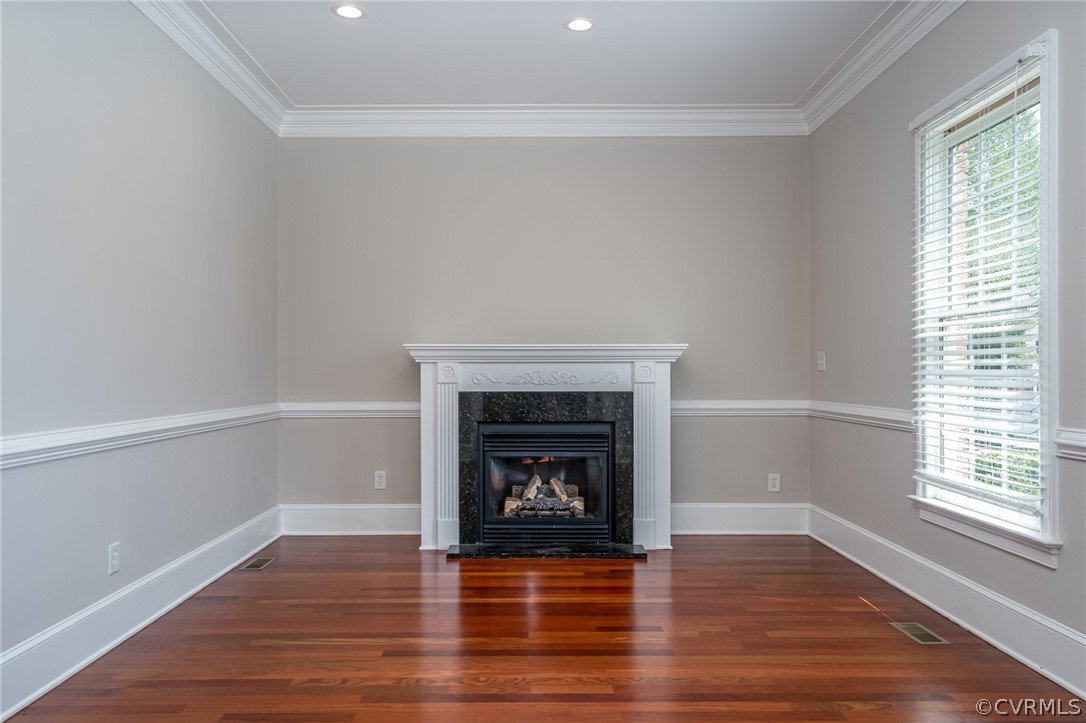 209 Castlerock Williamsburg, VA 23188 - Photo 14 of 31 a room with a fireplace and wooden floor