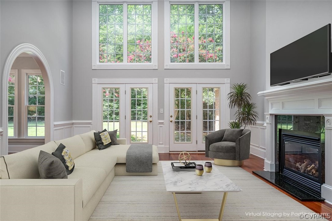 209 Castlerock Williamsburg, VA 23188 - Photo 2 of 31 a living room with furniture a flat screen tv and a fireplace