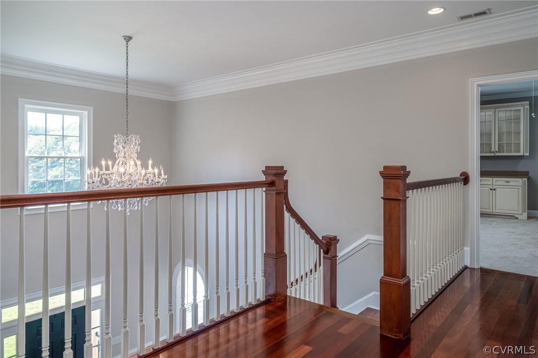 209 Castlerock Williamsburg, VA 23188 - Photo 22 of 31 a view of a hallway with wooden floor and stairs