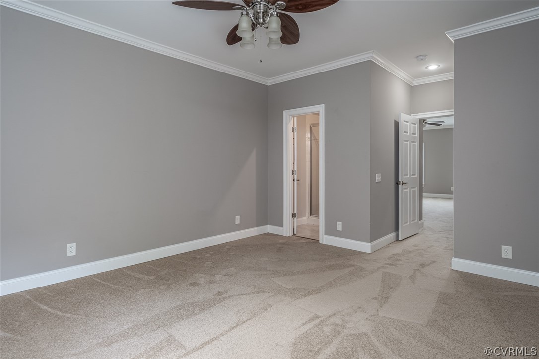 209 Castlerock Williamsburg, VA 23188 - Photo 27 of 31 an empty room with a chandelier fan and windows