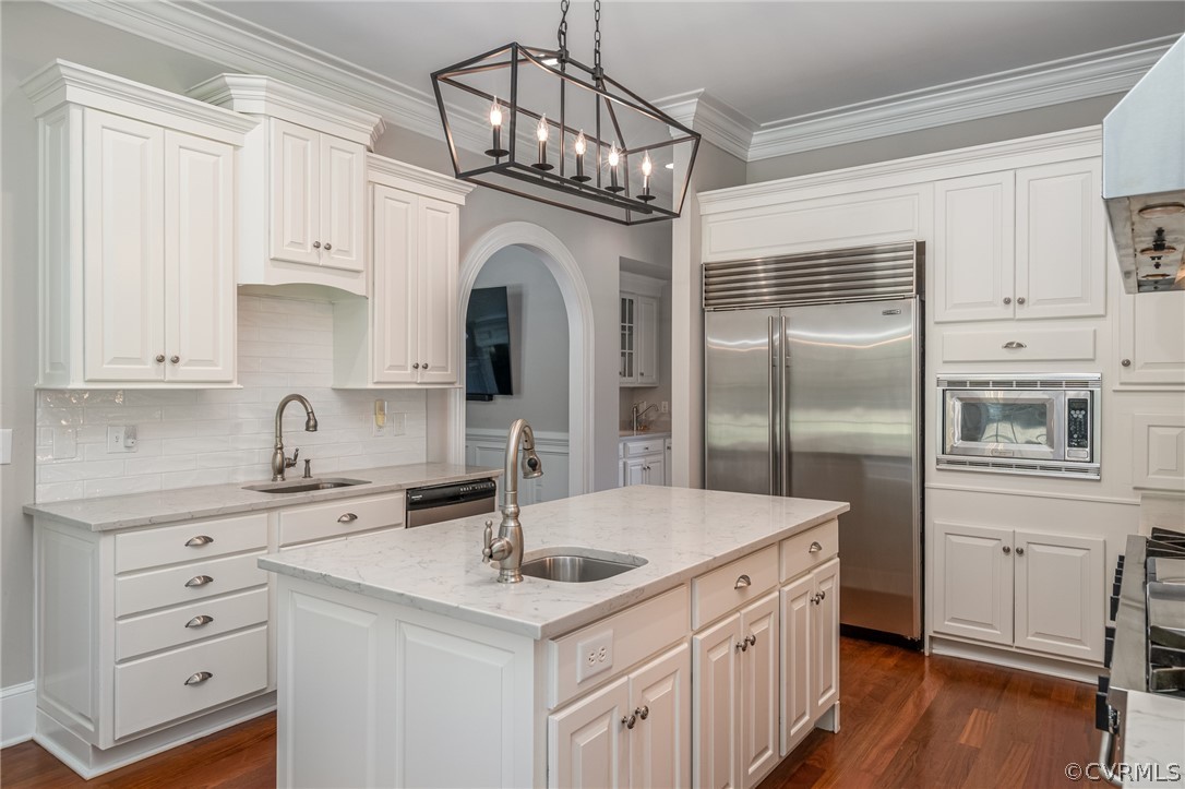 209 Castlerock Williamsburg, VA 23188 - Photo 7 of 31 a kitchen with stainless steel appliances a sink cabinets and wooden floor