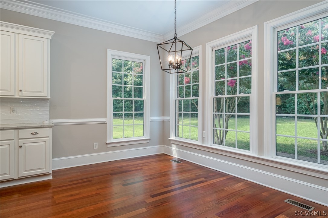 209 Castlerock Williamsburg, VA 23188 - Photo 9 of 31 a view of an empty room with wooden floor and a window