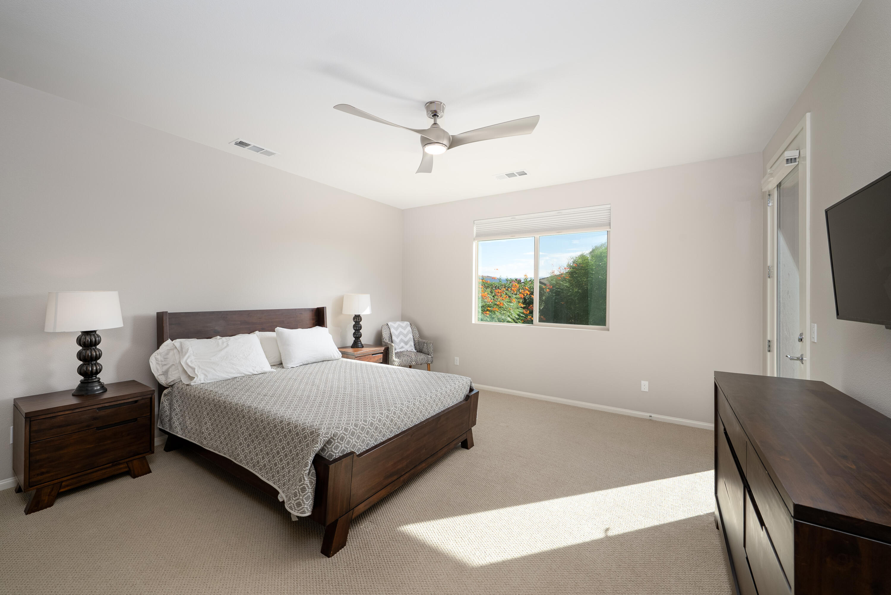 50380 Timber Creek Way Indio, CA 92201 - Photo 11 of 50 a bedroom with a bed and a flat screen tv
