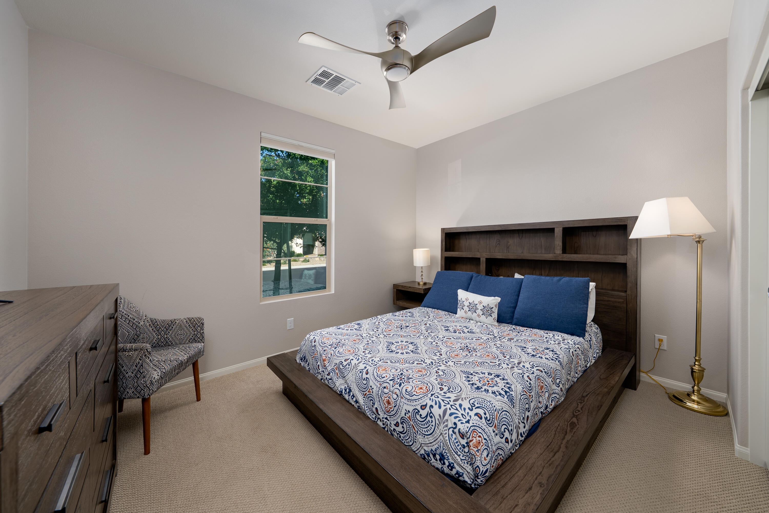 50380 Timber Creek Way Indio, CA 92201 - Photo 16 of 50 a bedroom with a bed a table and chair
