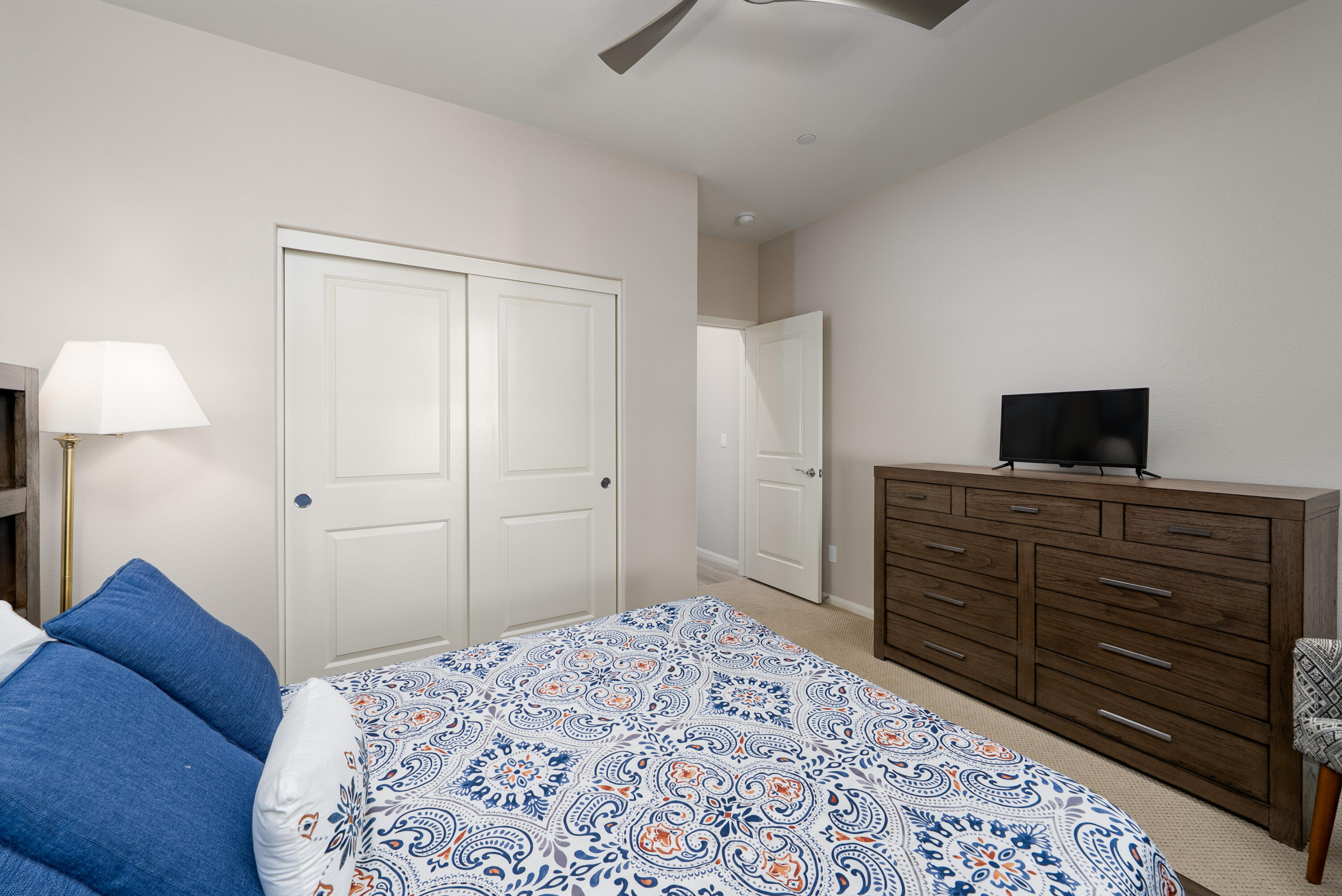 50380 Timber Creek Way Indio, CA 92201 - Photo 17 of 50 a bedroom with a bed and a flat screen tv
