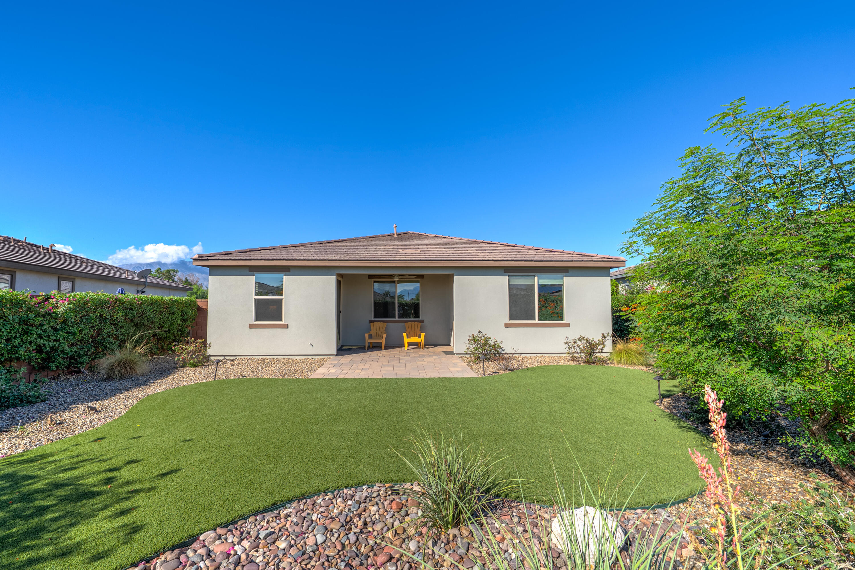 50380 Timber Creek Way Indio, CA 92201 - Photo 25 of 50 a front view of a house with a yard and porch