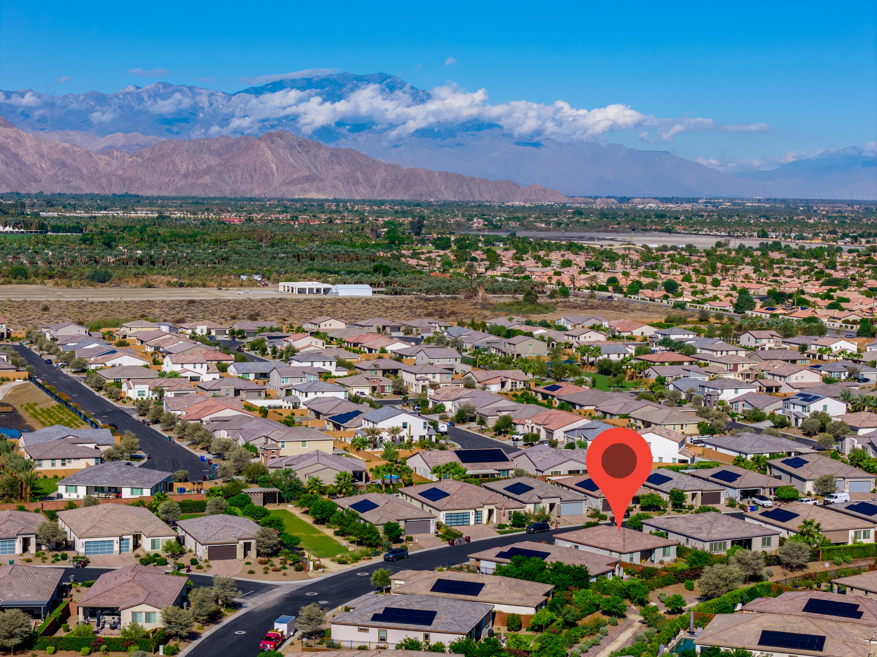 50380 Timber Creek Way Indio, CA 92201 - Photo 28 of 50 a view of a city with lots of residential buildings and mountain view in back