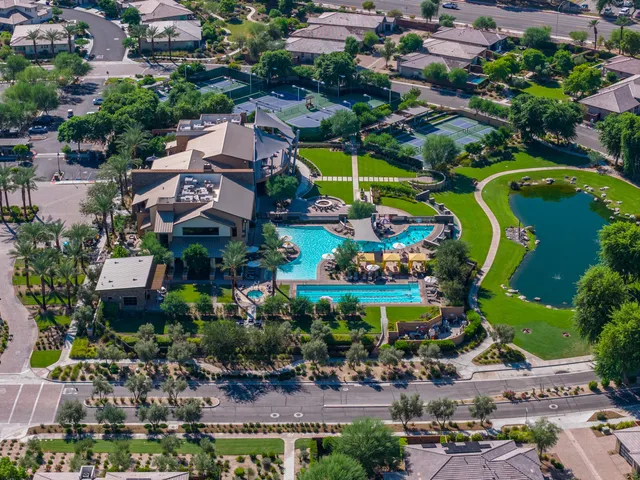 an aerial view of residential house with outdoor space and swimming pool
