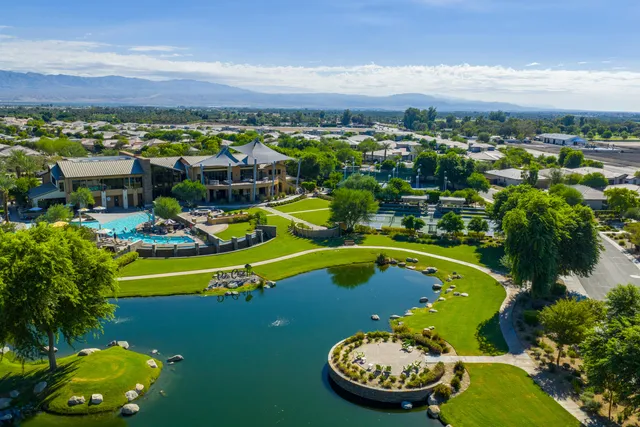 a view of a swimming pool with a lake and mountain view