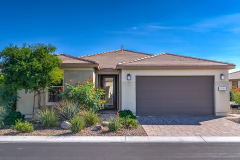 a front view of a house with a garage