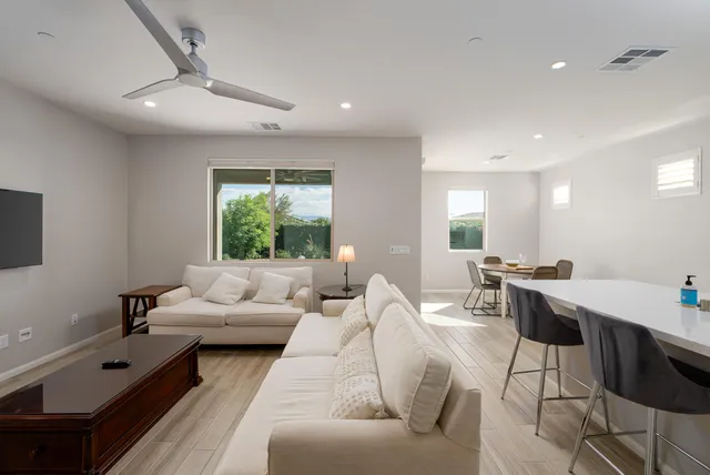 a living room with furniture and a large window