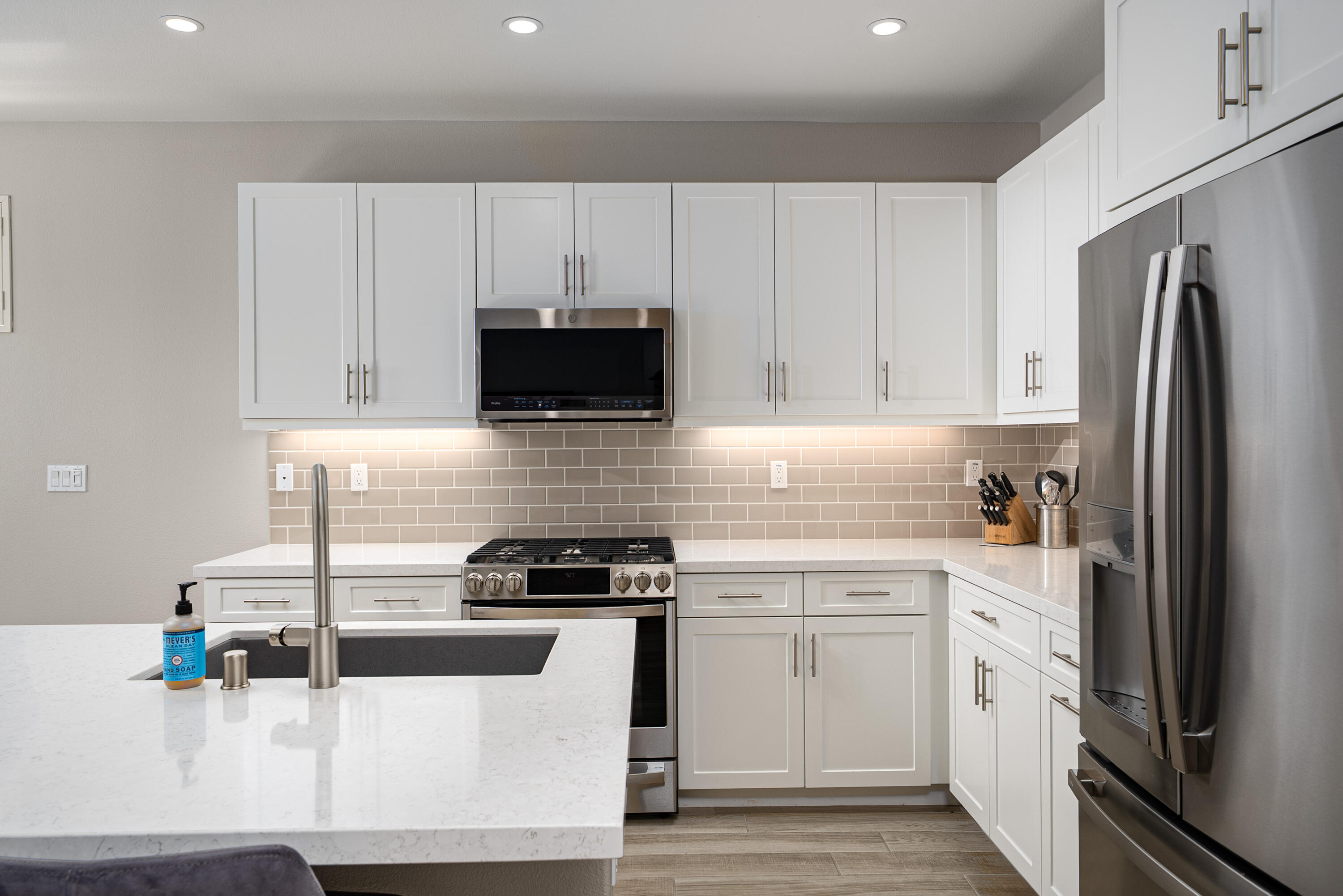 50380 Timber Creek Way Indio, CA 92201 - Photo 6 of 50 a kitchen with white cabinets and appliances