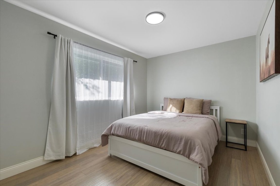 5313 Harvest Lane Austin, TX 78745 - Photo 20 of 28 a bedroom with a bed and a window