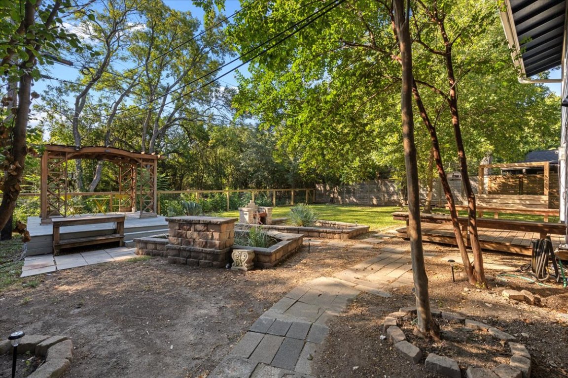 5313 Harvest Lane Austin, TX 78745 - Photo 27 of 28 a view of a backyard with sitting area