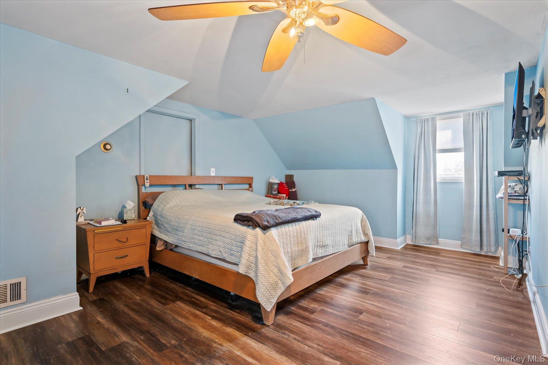 280 Moriches Road St. James, NY 11780 - Photo 13 of 39 a bedroom with a bed and wooden floor