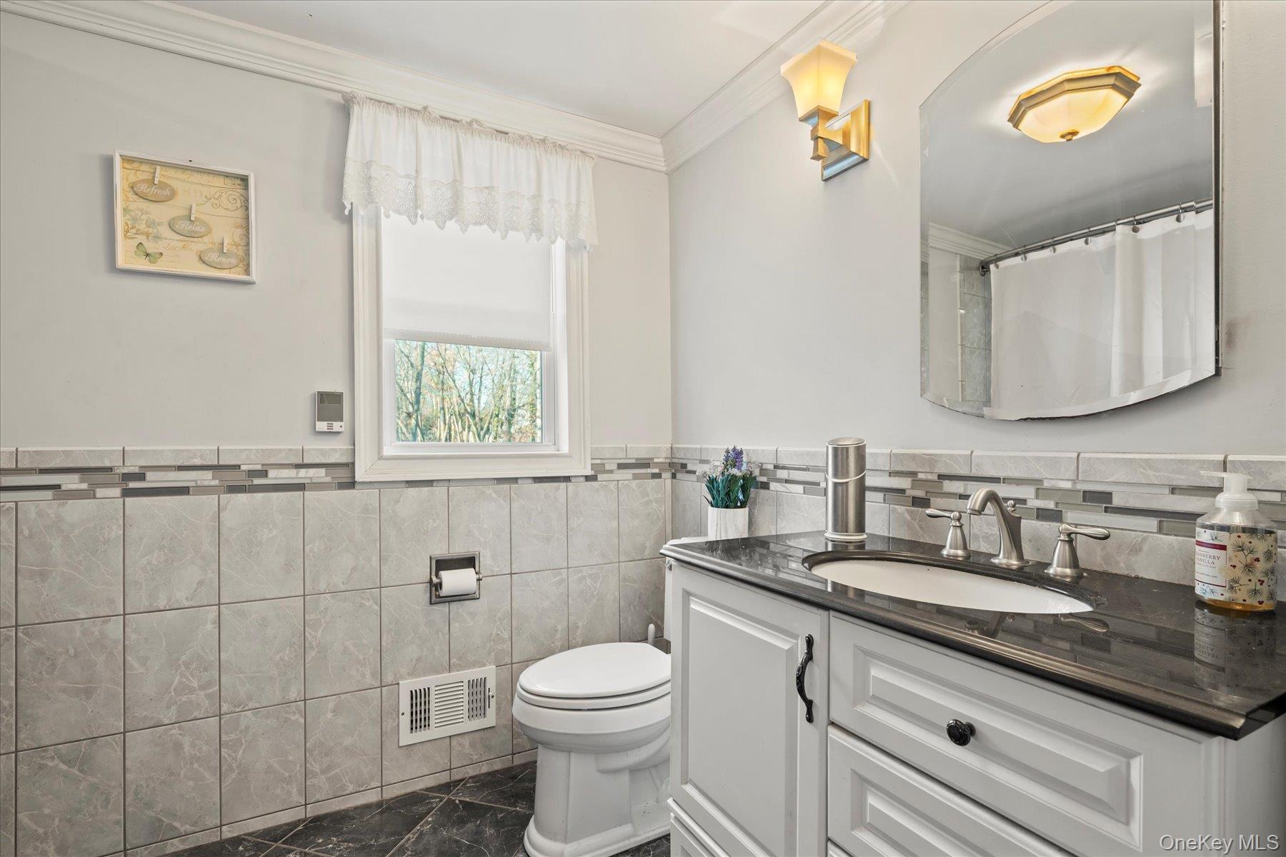 280 Moriches Road St. James, NY 11780 - Photo 16 of 39 a bathroom with a granite countertop toilet sink and mirror