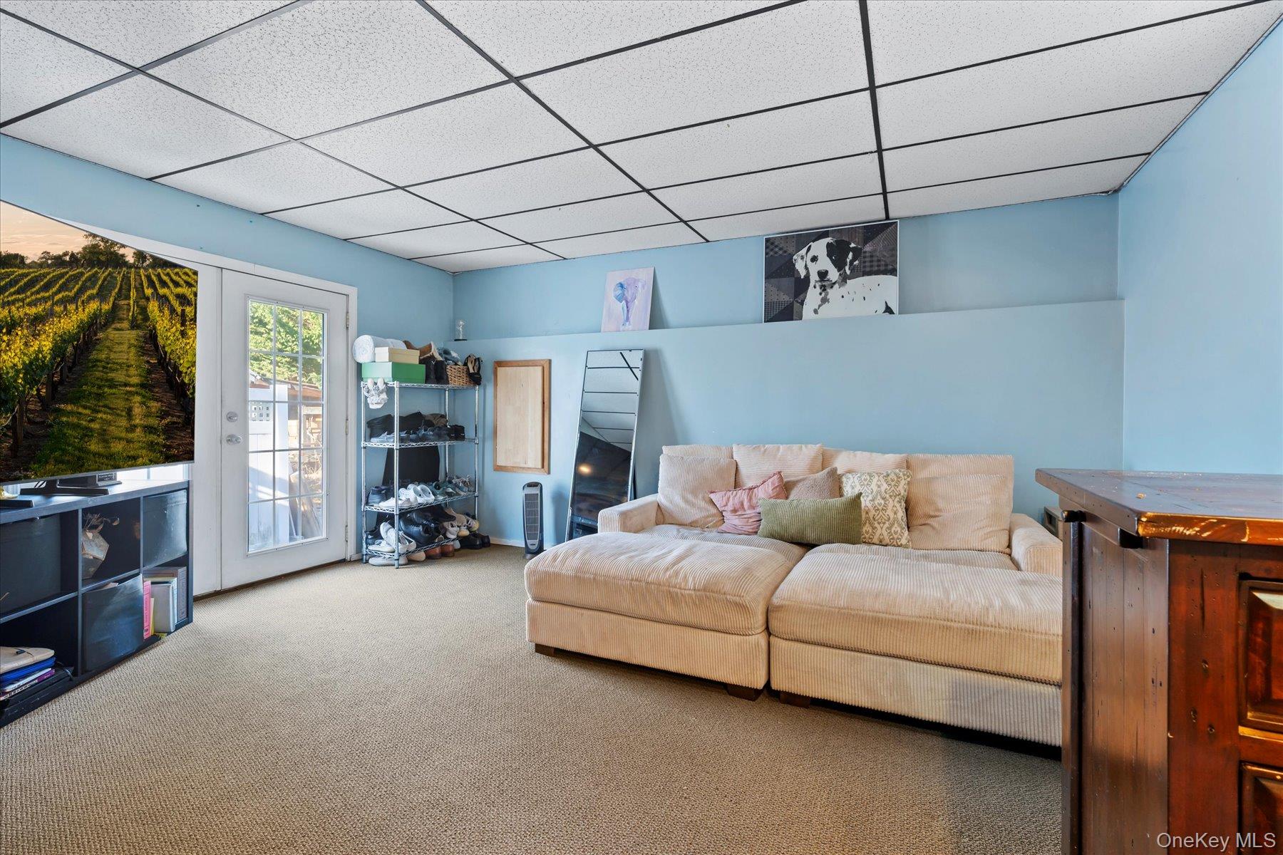 280 Moriches Road St. James, NY 11780 - Photo 20 of 39 a living room with furniture and a flat screen tv