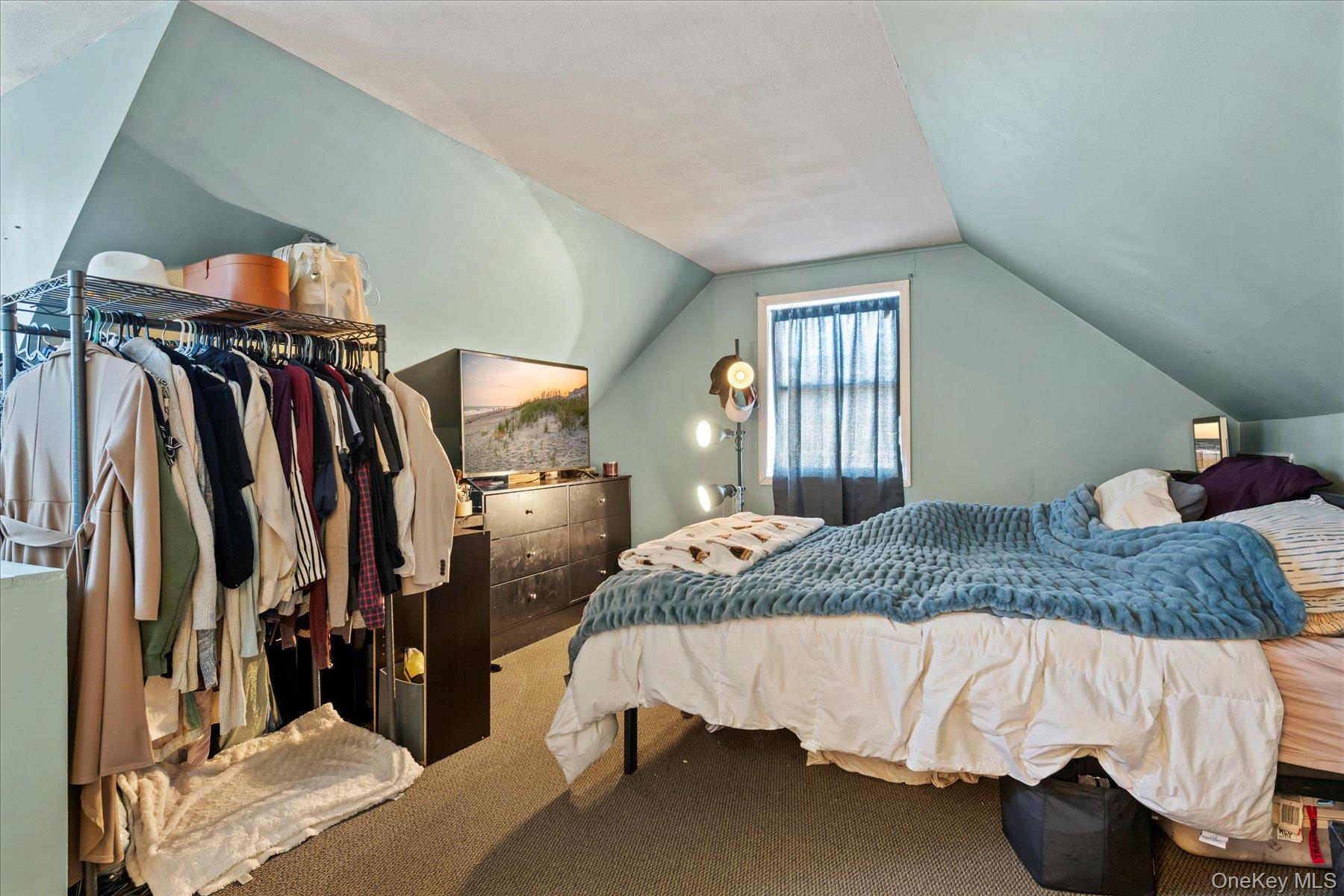 280 Moriches Road St. James, NY 11780 - Photo 23 of 39 a bedroom with a bed and walk in closet