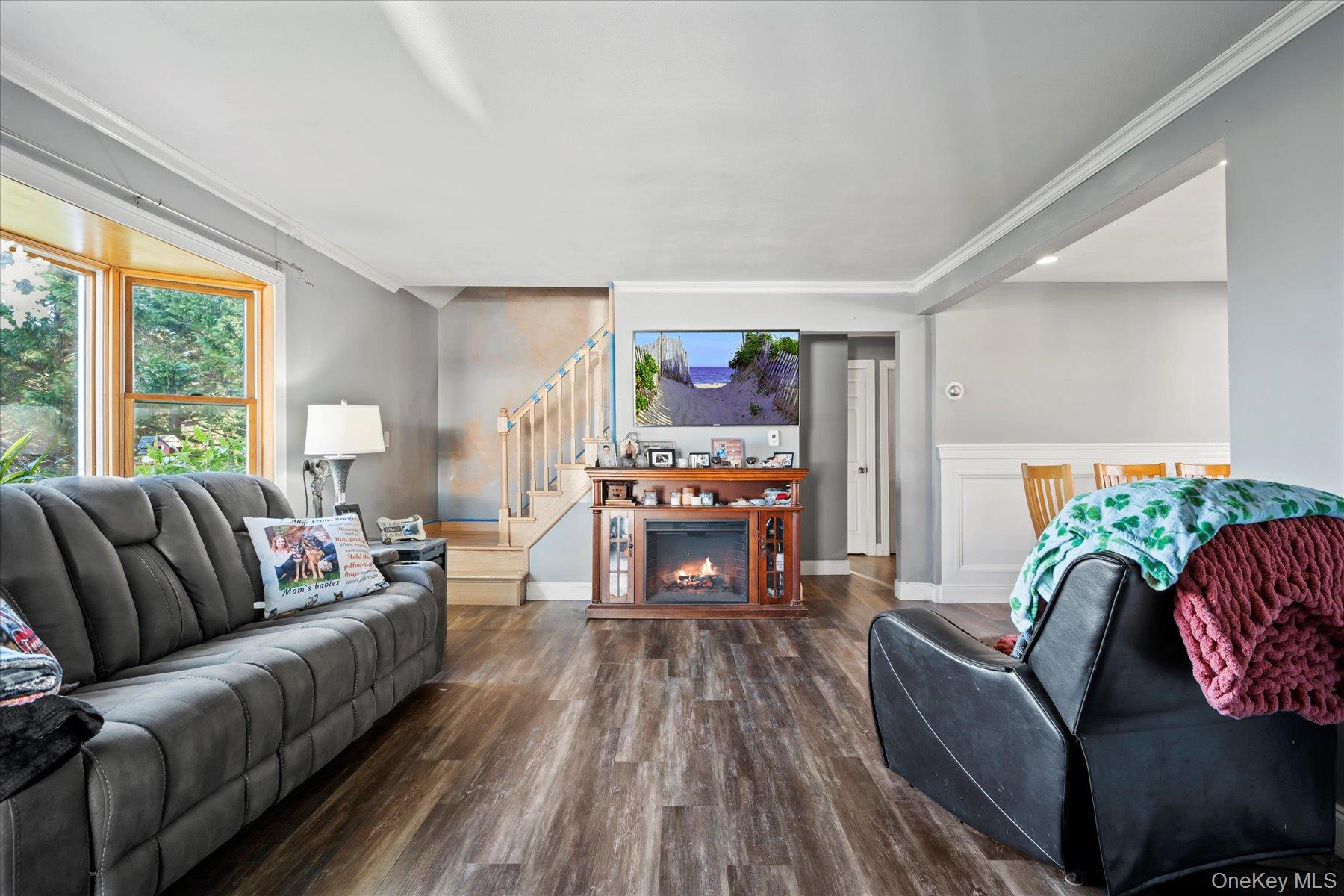 280 Moriches Road St. James, NY 11780 - Photo 3 of 39 a living room with furniture and a fireplace