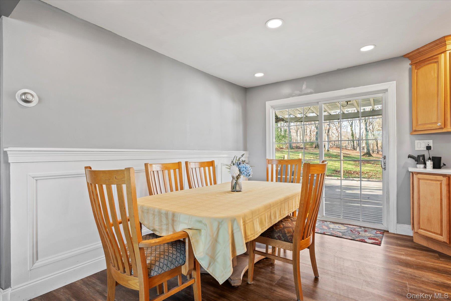 280 Moriches Road St. James, NY 11780 - Photo 6 of 39 a view of a dining room with furniture window and wooden floor