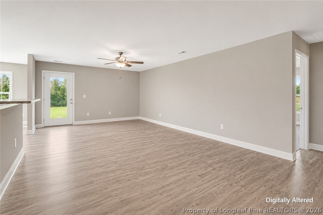 756 Jordan Road Autryville, NC 28318 - Photo 11 of 34 wooden floor in an empty room with a window