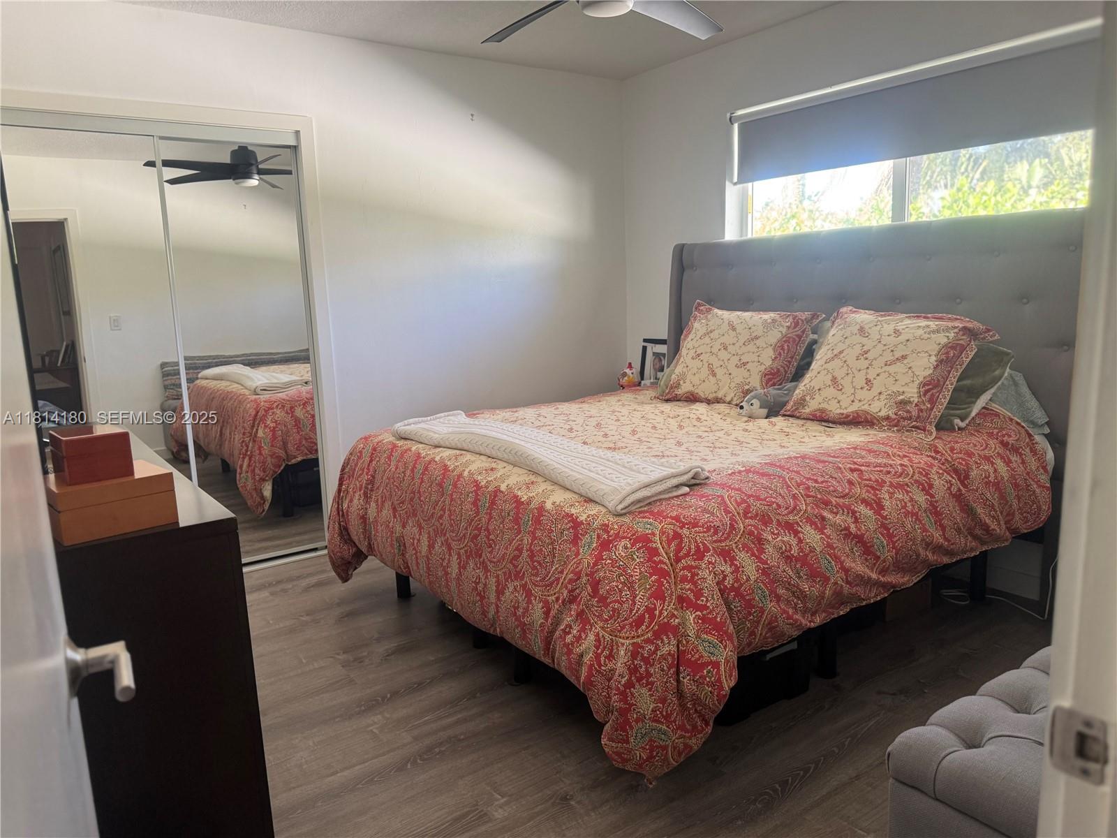 220 Northwest 130th Avenue Miami, FL 33182 - Photo 15 of 32 a bedroom with a bed and window