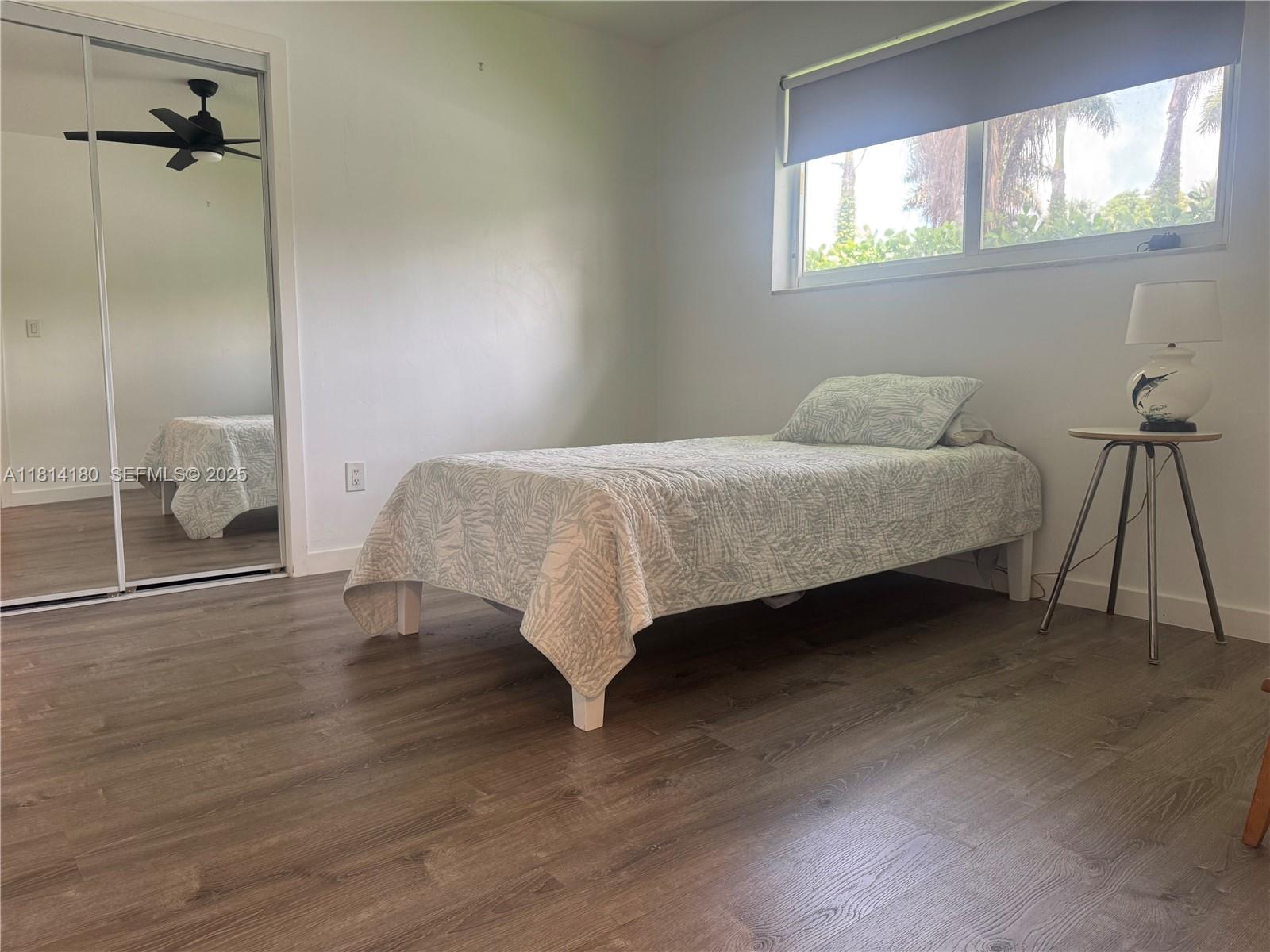 220 Northwest 130th Avenue Miami, FL 33182 - Photo 17 of 32 a bedroom with a bed and a window