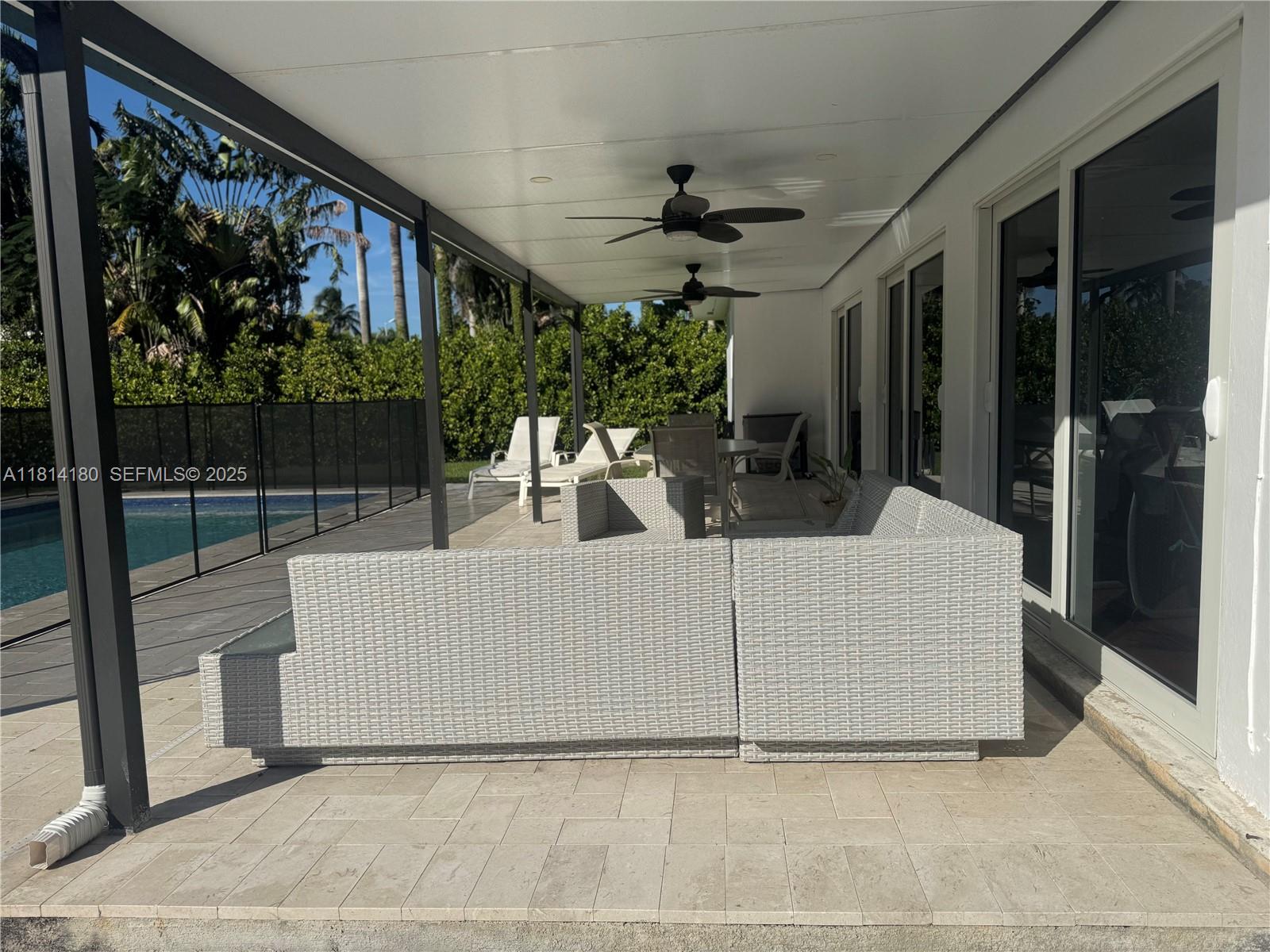 220 Northwest 130th Avenue Miami, FL 33182 - Photo 27 of 32 a view of living room kitchen with furniture and outdoor space