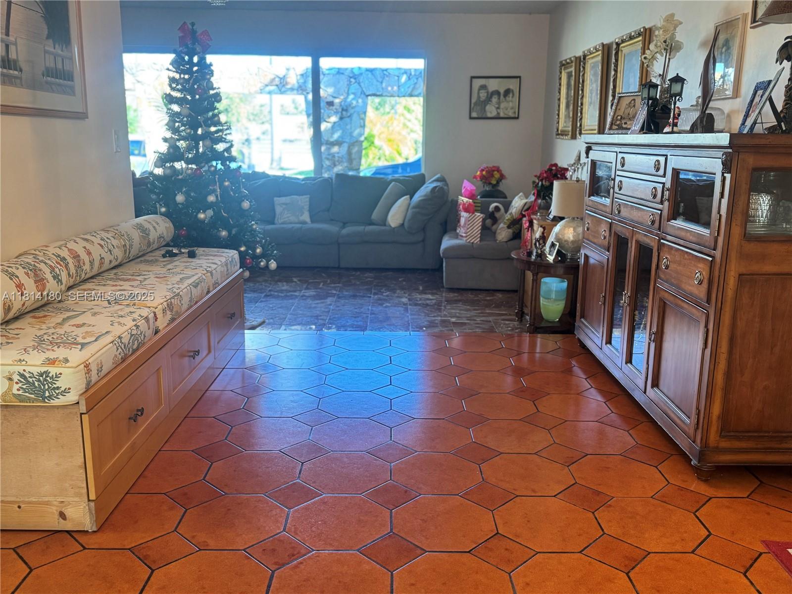 220 Northwest 130th Avenue Miami, FL 33182 - Photo 10 of 32 a living room with furniture and a window