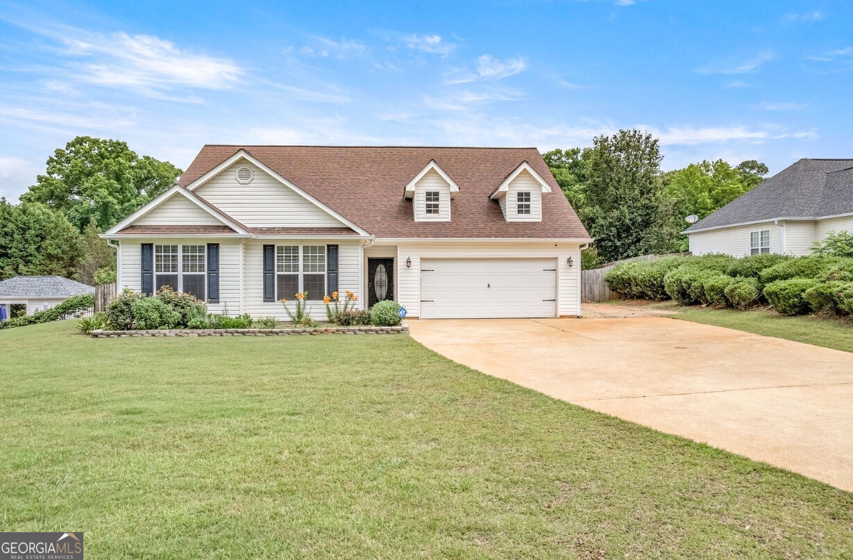 82 Newton Road LaGrange, GA 30240 - Photo 31 of 45 a house with huge green field in front of it