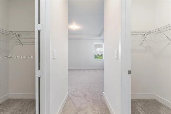 a view of a bathroom from a hallway