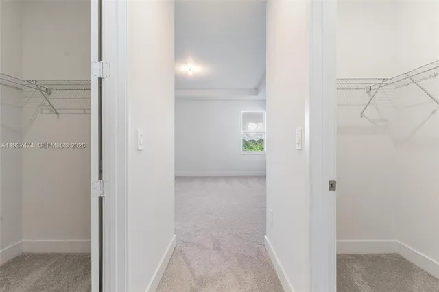a view of a bathroom from a hallway