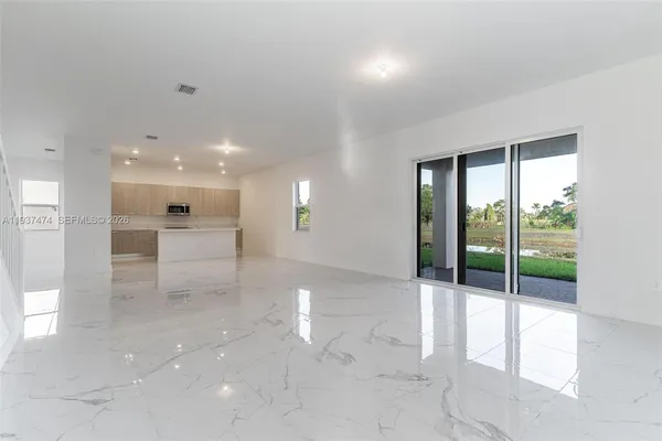 a view of an empty room with a sliding door