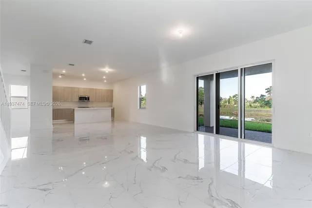 a view of an empty room with a sliding door