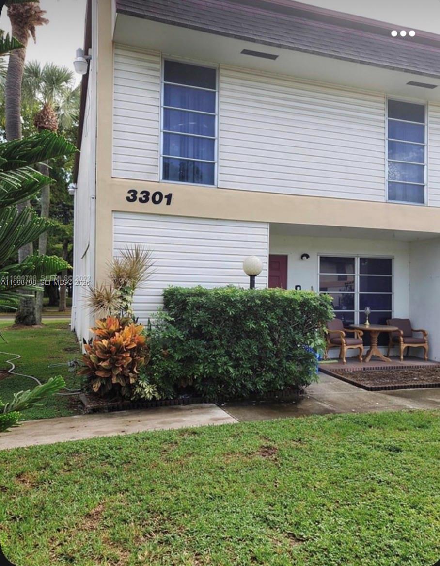 3301 Raleigh Street, Unit 4A Hollywood, FL 33021 - Photo 1 of 11 a view of a house with sitting area and garden