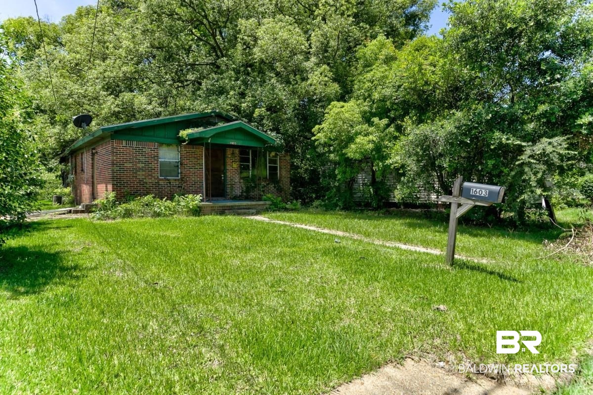 1603 Wexford Street Mobile, AL 36605 - Photo 2 of 10 View of front of house with brick siding and a front lawn