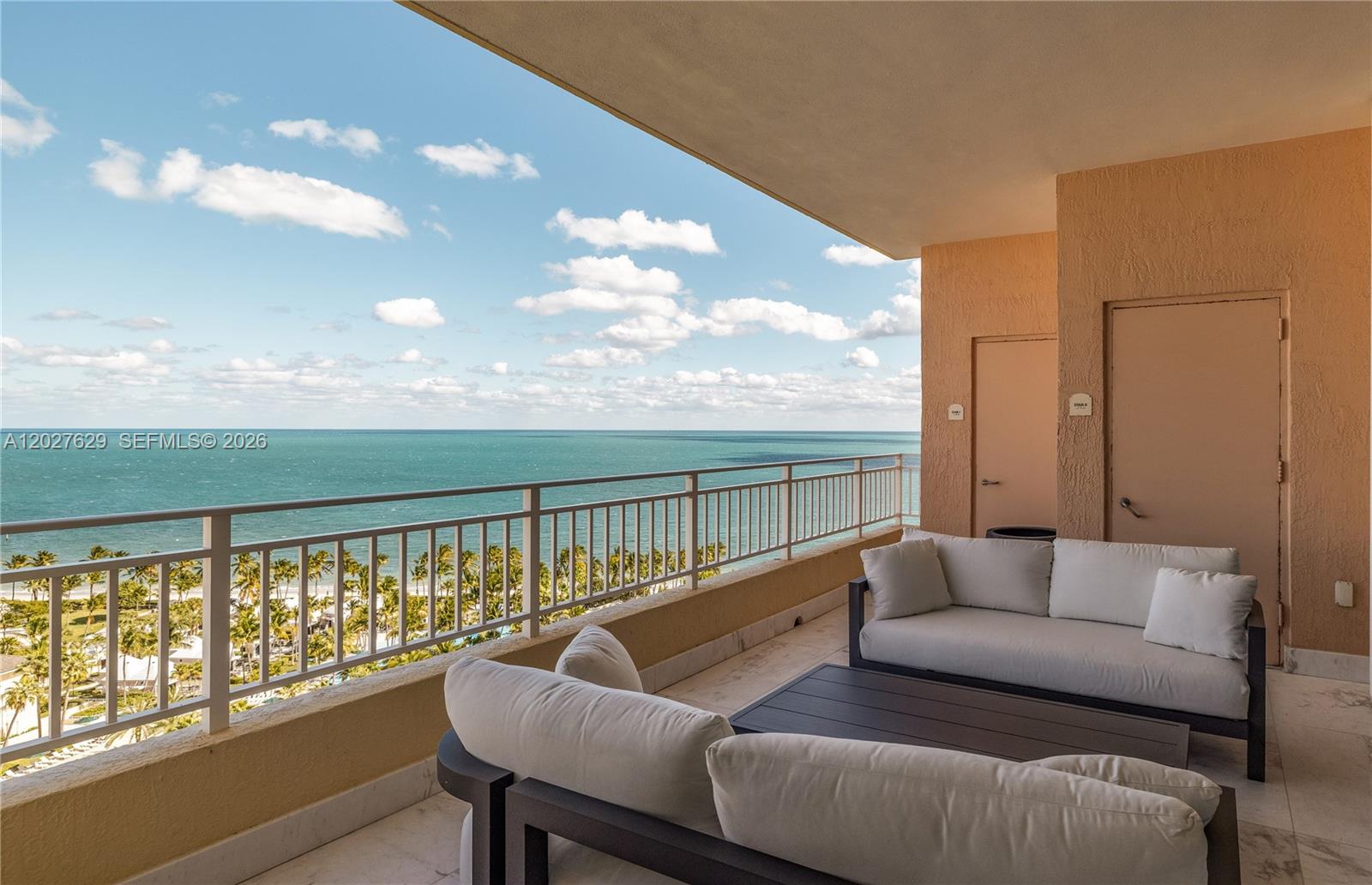 799 Crandon Boulevard, Unit PH8 Key Biscayne, FL 33149 - Photo 30 of 47 a living room with furniture and a large window
