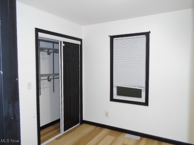 10971 Auburn Road Chardon, OH 44024 - Photo 14 of 40 Unfurnished bedroom with a closet and light wood finished floors