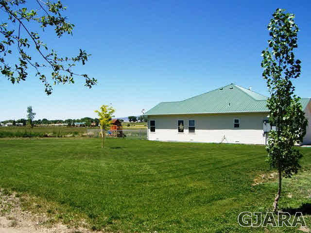 4419 1900th Road Delta, CO 81416 - Photo 3 of 13 a front view of a house with garden
