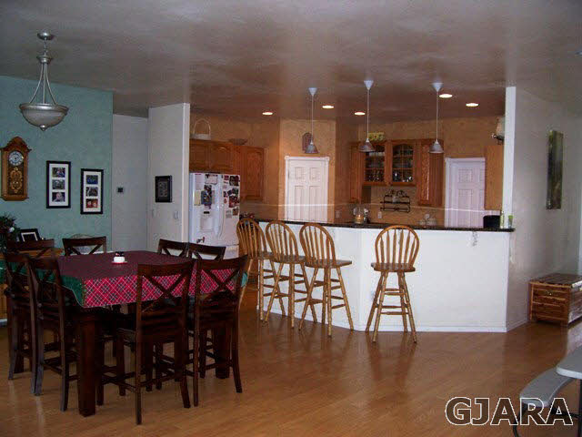 4419 1900th Road Delta, CO 81416 - Photo 4 of 13 a view of a dining room with furniture and wooden floor