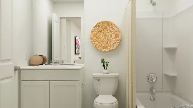 a bathroom with a sink a toilet and vanity