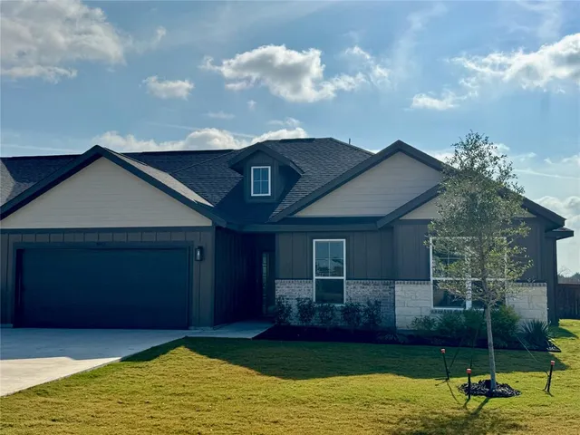 a house with garden in front of it