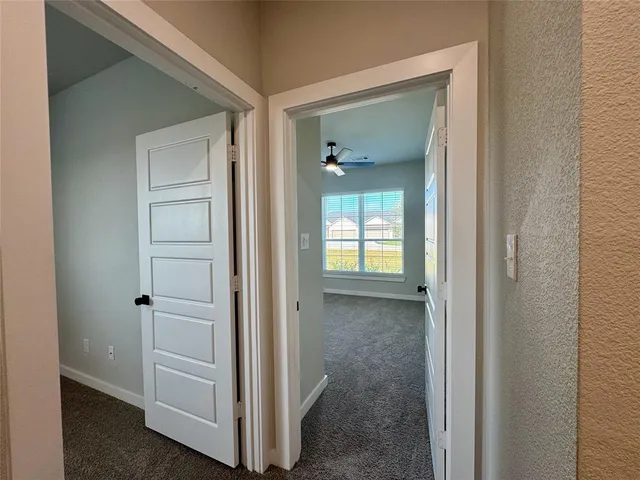 a view of a bathroom with mirror