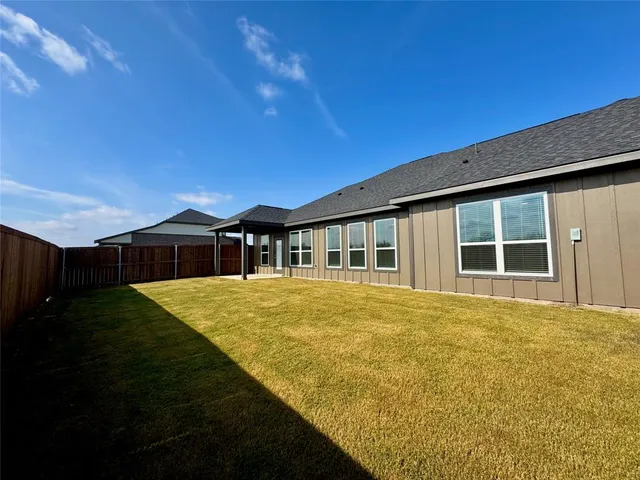 a front view of a house with yard